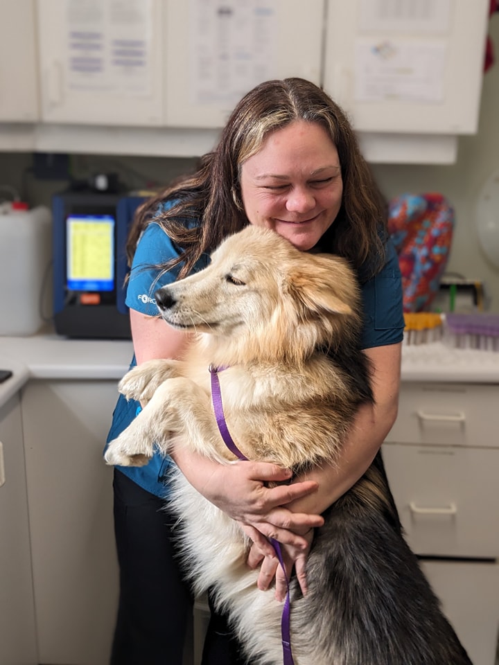 Crystal embracing dog